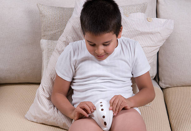 little boy wearing protective underwear after circumcision.